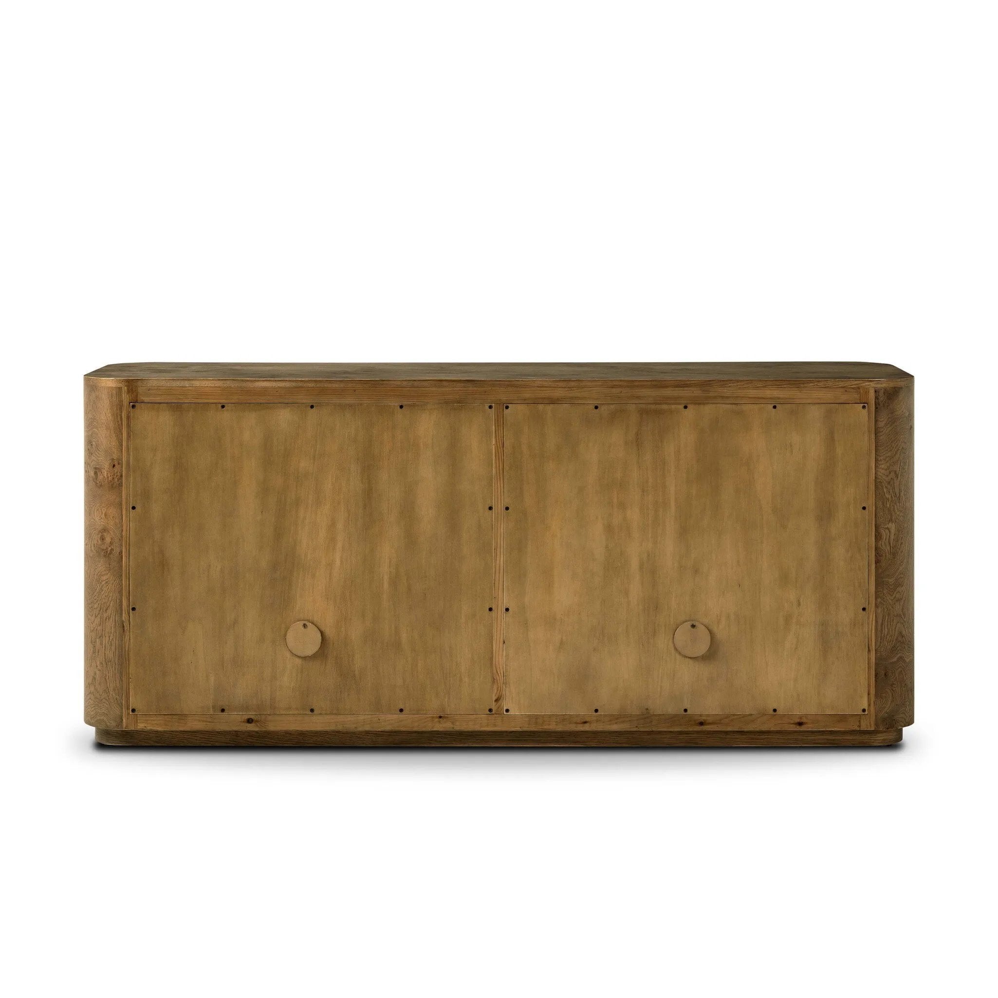 Finished in a unique rye, a mix of solid oak and oak veneer shape a simplified four-door sideboard, with subtly rounded corners for a touch of softness. Large, exaggerated hardware finishes the look.As fans of natural aesthetics at Amethyst, we love the nature inspired Morley Sideboard - Rye Medium Burl Oak Veneer. Amethyst Home provides interior design, new home construction design consulting, vintage area rugs, and lighting in the Boston metro area.