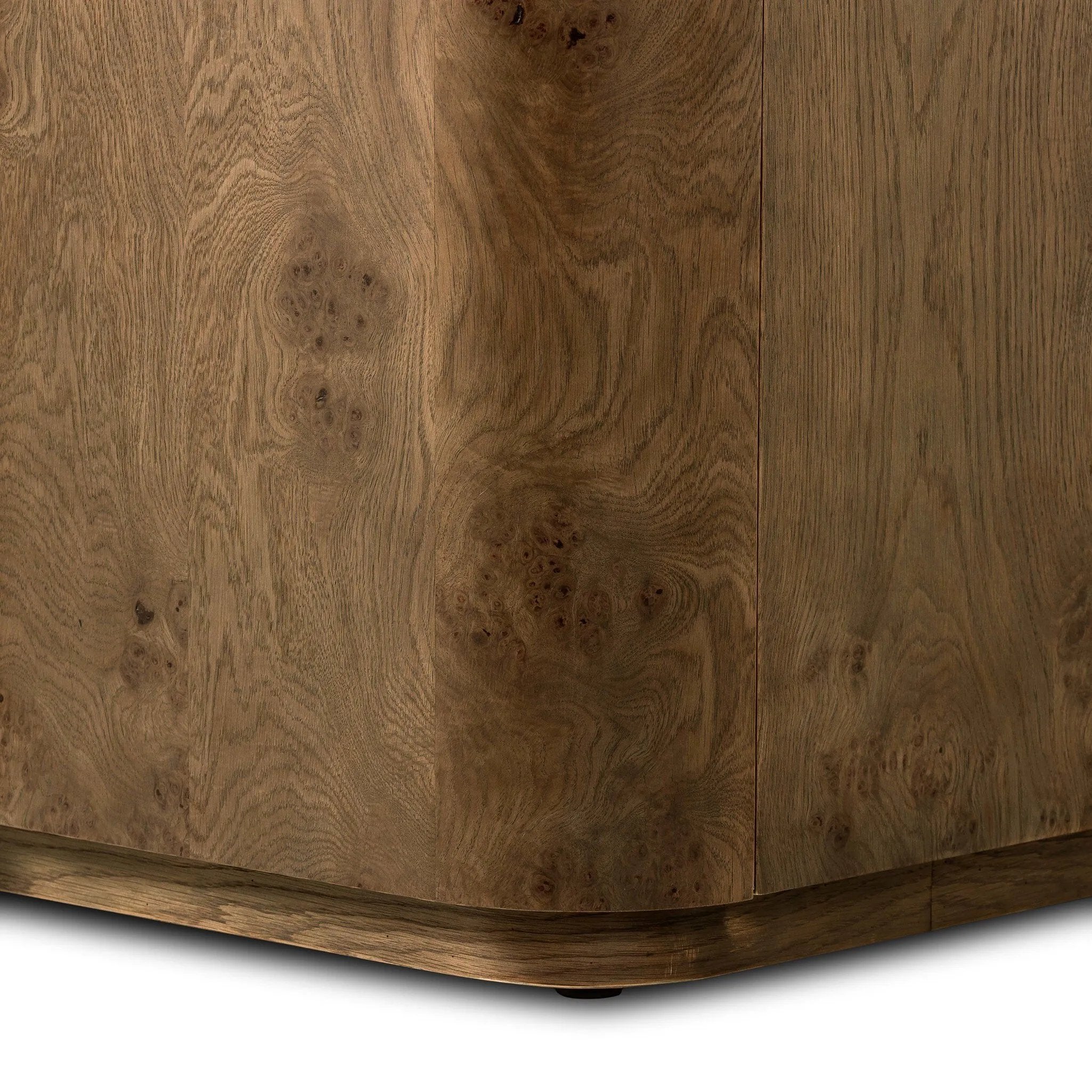 Finished in a unique rye, a mix of solid oak and oak veneer shape a simplified four-door sideboard, with subtly rounded corners for a touch of softness. Large, exaggerated hardware finishes the look.As fans of natural aesthetics at Amethyst, we love the nature inspired Morley Sideboard - Rye Medium Burl Oak Veneer. Amethyst Home provides interior design, new home construction design consulting, vintage area rugs, and lighting in the Charlotte metro area.