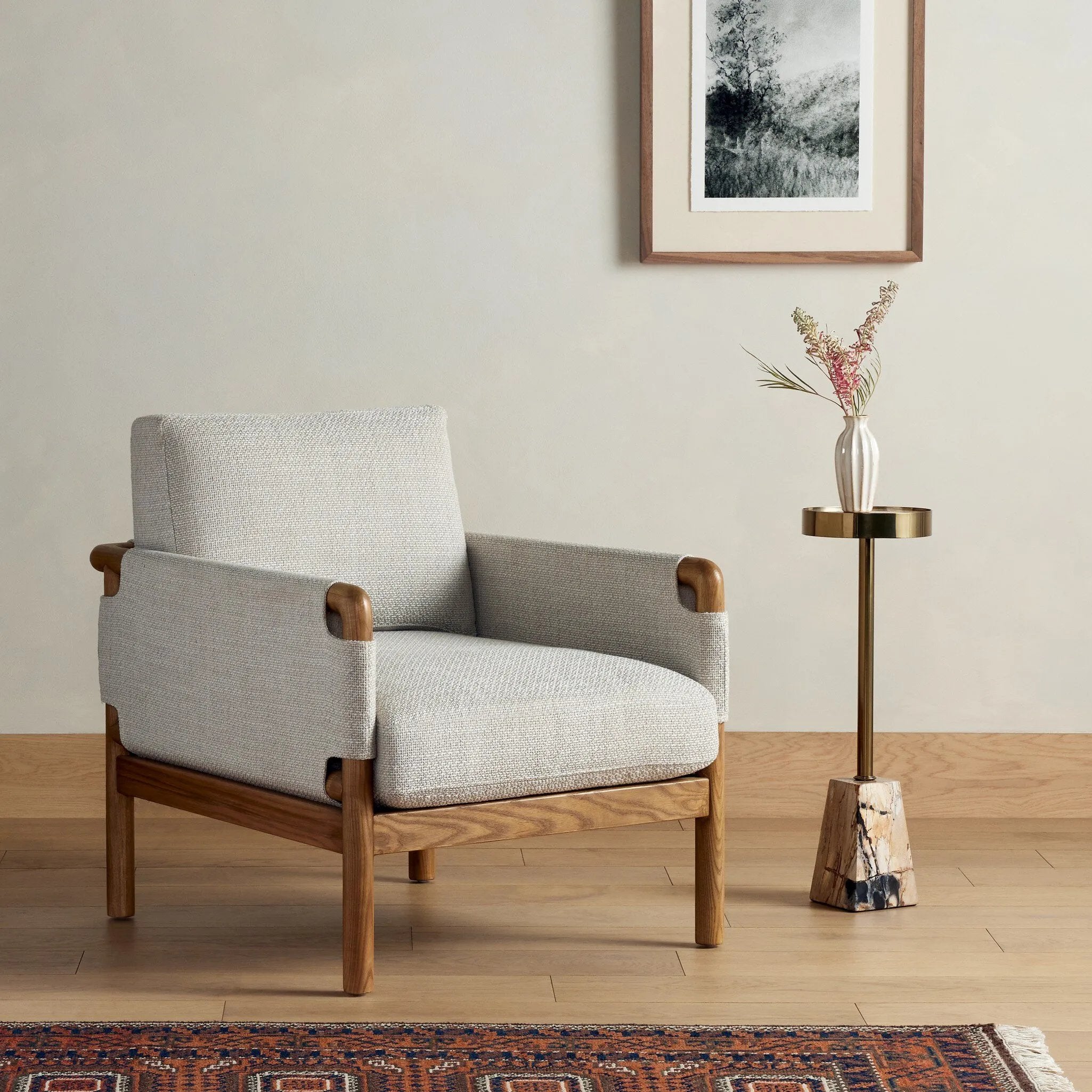 Safari inspiration meets zen aspirations. A cylindrical frame is crafted, smoothed and rounded from solid ash wood. Includes two loose feather-blend cushions covered in a heavily textured performance fabric. Amethyst Home provides interior design, new home construction design consulting, vintage area rugs, and lighting in the Monterey metro area.