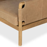 Featuring Navarro Palermo Drift Chair by Four Hands at Amethyst Home. Safari inspiration meets zen aspirations. A cylindrical frame is crafted, smoothed and rounded from solid ash wood. Includes two loose feather-blend cushions covered in subtly distressed thick cut leather in a neutral taupe hue for a monochromatic look. Overall Dimensions: 27.75"w x 34.00. Amethyst Home provides interior design, new home construction design consulting, vintage area rugs, and lighting in the Calabasas metro area.