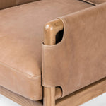 Featuring Navarro Palermo Drift Chair by Four Hands at Amethyst Home. Safari inspiration meets zen aspirations. A cylindrical frame is crafted, smoothed and rounded from solid ash wood. Includes two loose feather-blend cushions covered in subtly distressed thick cut leather in a neutral taupe hue for a monochromatic look. Overall Dimensions: 27.75"w x 34.00. Amethyst Home provides interior design, new home construction design consulting, vintage area rugs, and lighting in the Charlotte metro area.