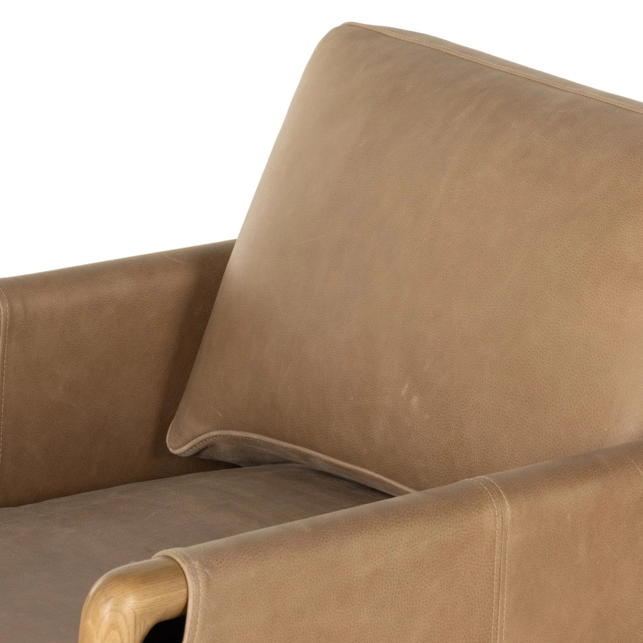 Featuring Navarro Palermo Drift Chair by Four Hands at Amethyst Home. Safari inspiration meets zen aspirations. A cylindrical frame is crafted, smoothed and rounded from solid ash wood. Includes two loose feather-blend cushions covered in subtly distressed thick cut leather in a neutral taupe hue for a monochromatic look. Overall Dimensions: 27.75"w x 34.0. Amethyst Home provides interior design, new home construction design consulting, vintage area rugs, and lighting in the Washington metro area.