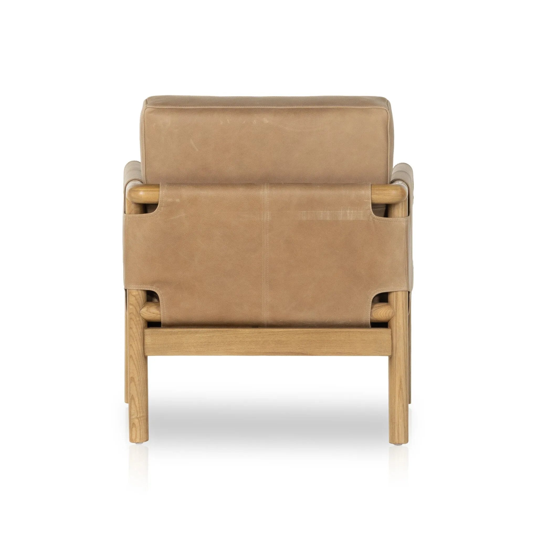 Featuring Navarro Palermo Drift Chair by Four Hands at Amethyst Home. Safari inspiration meets zen aspirations. A cylindrical frame is crafted, smoothed and rounded from solid ash wood. Includes two loose feather-blend cushions covered in subtly distressed thick cut leather in a neutral taupe hue for a monochromatic look. Overall Dimensions: 27.75"w x 3. Amethyst Home provides interior design, new home construction design consulting, vintage area rugs, and lighting in the Winter Garden metro area.