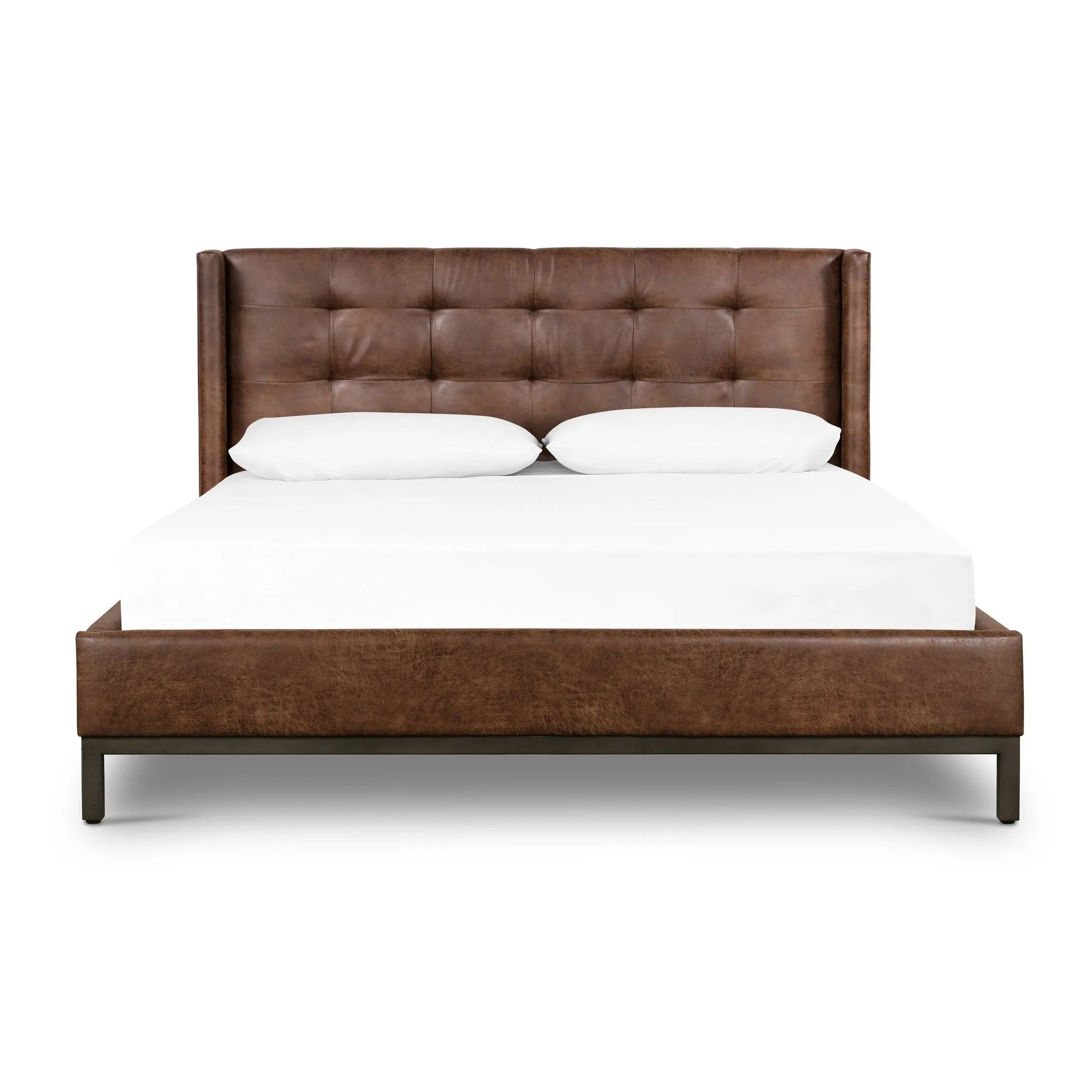 Subtle, modern elegance. A low, tufted headboard in a vintage tobacco faux leather pairs with a simple gunmetal iron base Amethyst Home provides interior design, new home construction design consulting, vintage area rugs, and lighting in the Park City metro area.