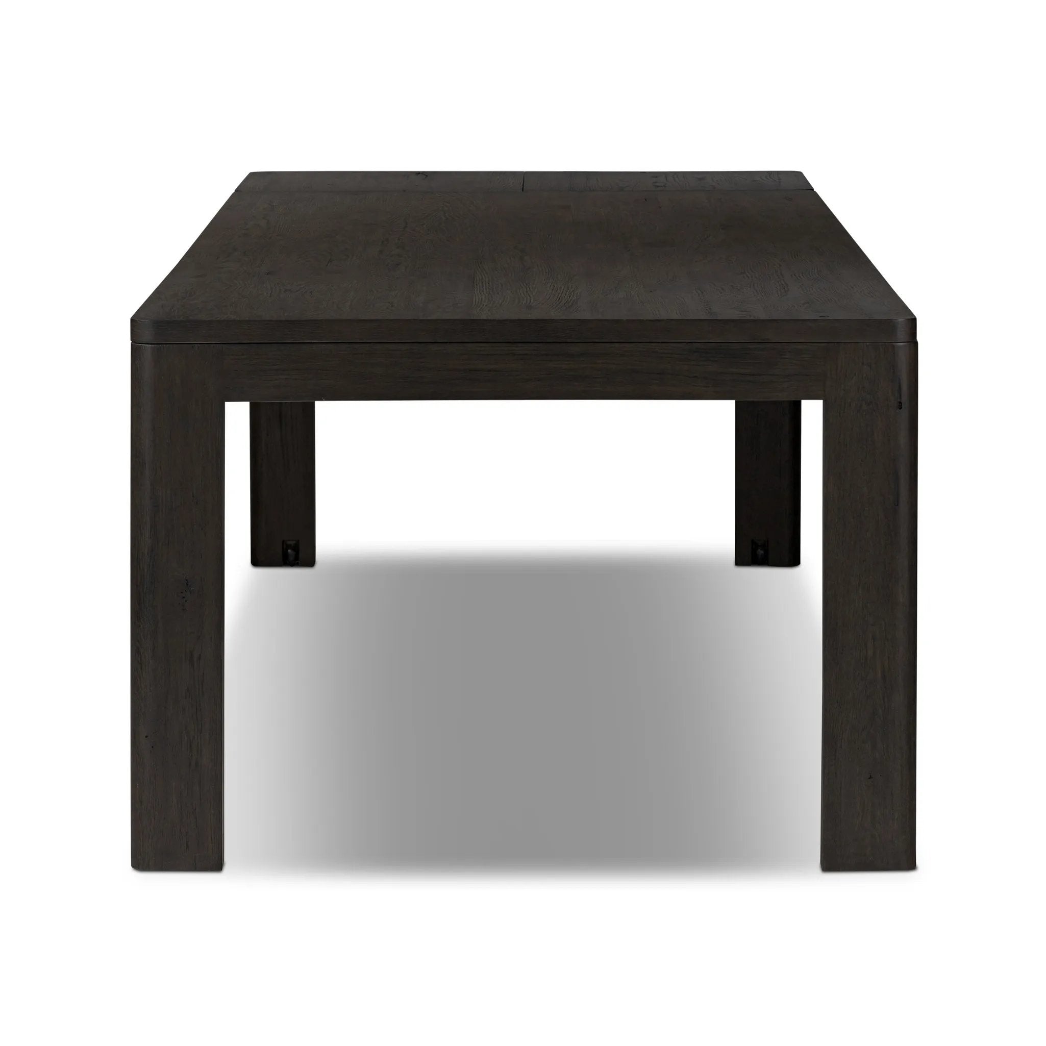 Featuring Noeline Cracked Smoked Black Veneer Extension Dining Table by Four Hands at Amethyst Home. Made from smoked black oak with intentional cracking for an aged look, a self-storing extension creates space for extra guests. Equipped with four lockable wheels for easy extension to 116".Overall Dimensions: 96.00"w x 42.00"d x 30.00"hWeight : 275.58 lbsMate. Amethyst Home provides interior design, new home construction design consulting, vintage area rugs, and lighting in the Seattle metro area.