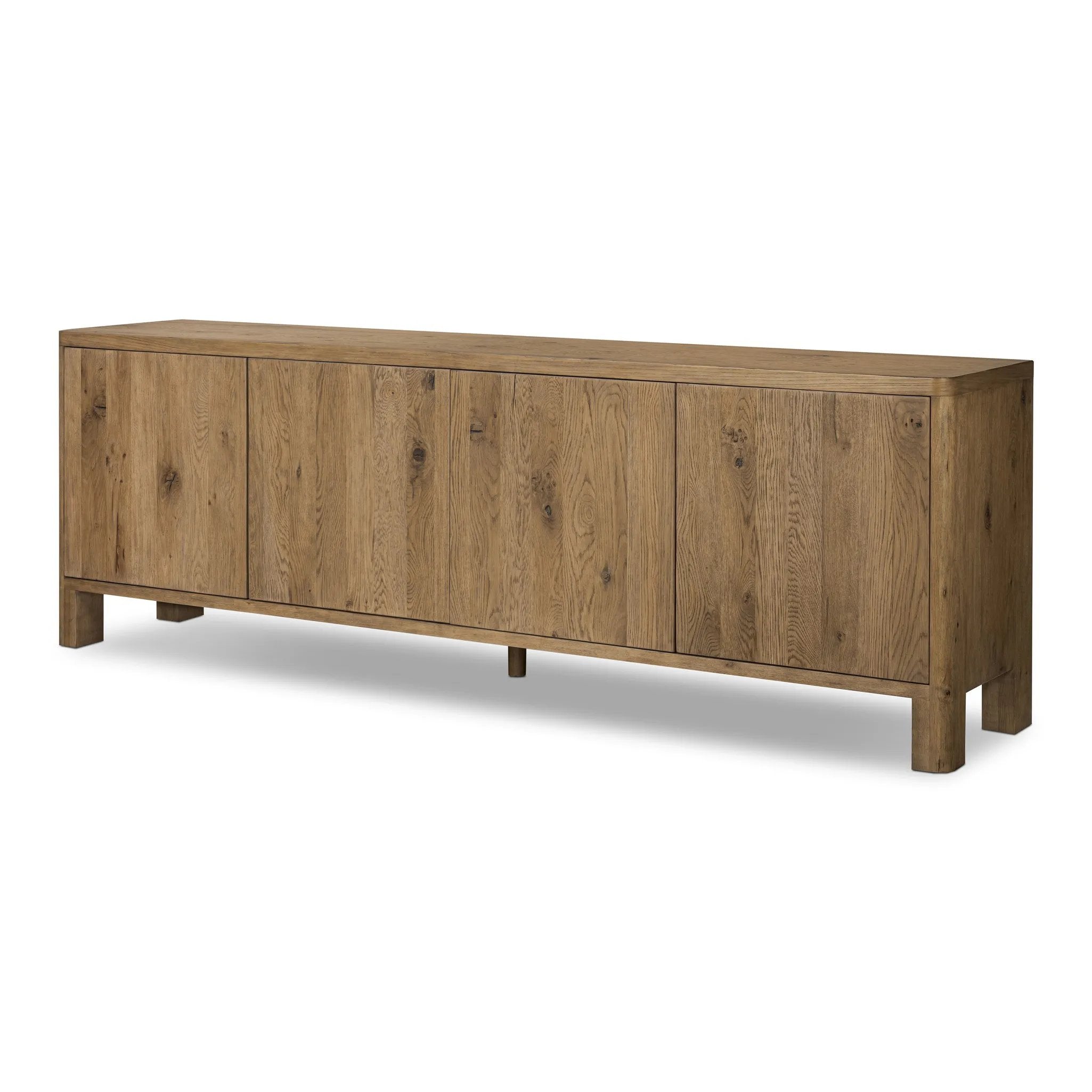 Made from resawn oak with a worn, natural finish, a long, streamlined sideboard offers ample storage space behind four push-latch doors. Subtly rounded corners add softness to otherwise clean lines, while knots and graining offer a naturally rich look. Dual rear cutouts for seamless cord management Amethyst Home provides interior design, new home construction design consulting, vintage area rugs, and lighting in the Boston metro area.