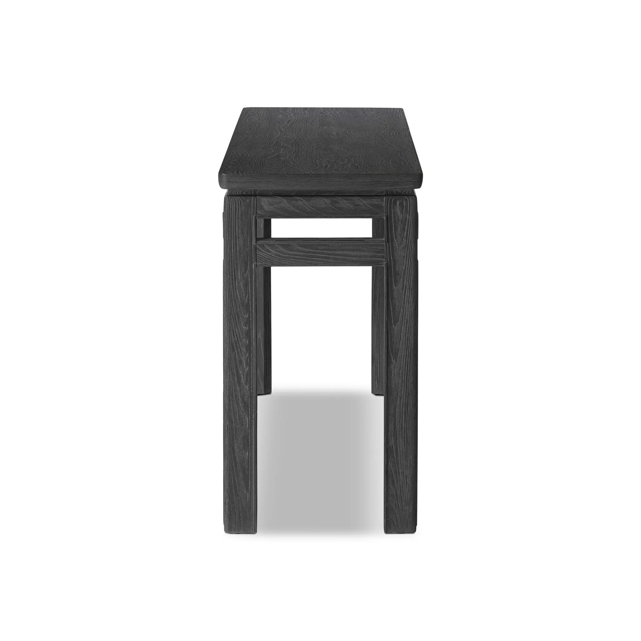 Featuring Oman Rustic Black Veneer Console Table by Four Hands at Amethyst Home. The traditional console table gets elevated with accent stretchers that bring a float-like look to simple shaping. Made from ash and oak, with a rustic black oak finish.Overall Dimensions: 78.00"w x 18.00"d x 32.00"hWeight : 108.03 lbsMaterials: Oak Veneer, Solid Ash, Enginee. Amethyst Home provides interior design, new home construction design consulting, vintage area rugs, and lighting in the Kansas City metro area.