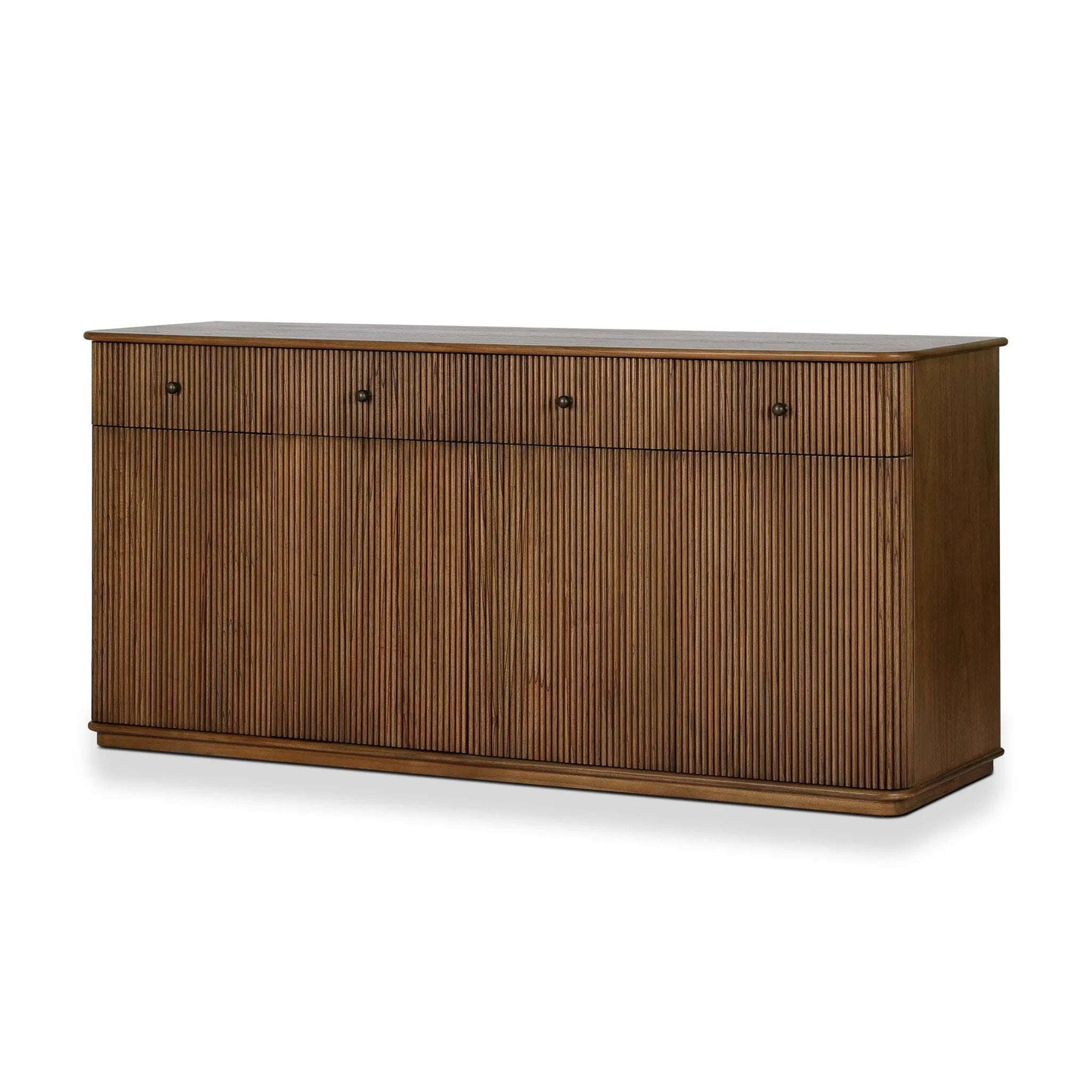 Store favorite table linens and serveware in a piece pairing craftsmanship and texture. Made from mindi wood with a plinth-style base, a reeding pattern is carved into the surface keeping this media look fresh and approachable. A spacious interior and amber oak finish complete this sculptural form. Amethyst Home provides interior design, new home construction design consulting, vintage area rugs, and lighting in the Seattle metro area.
