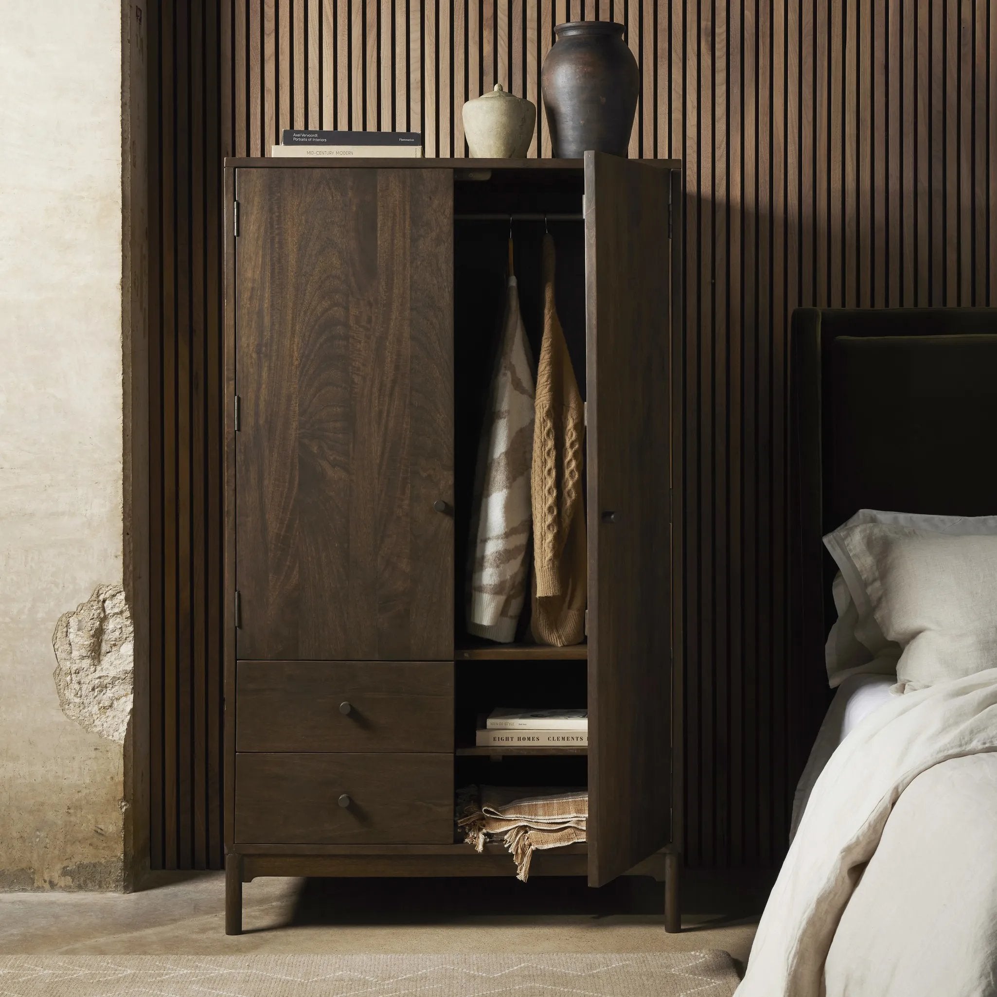 Make space for style. A large, storage-minded armoire is made from solid mango and finished in an aged brown, reminiscent of European antiques. Interior iron rod for hanging garments plus roomy drawers for out-of-sight storage. This item has been modified to comply with the STURDY Act. Amethyst Home provides interior design, new home construction design consulting, vintage area rugs, and lighting in the Dallas metro area.