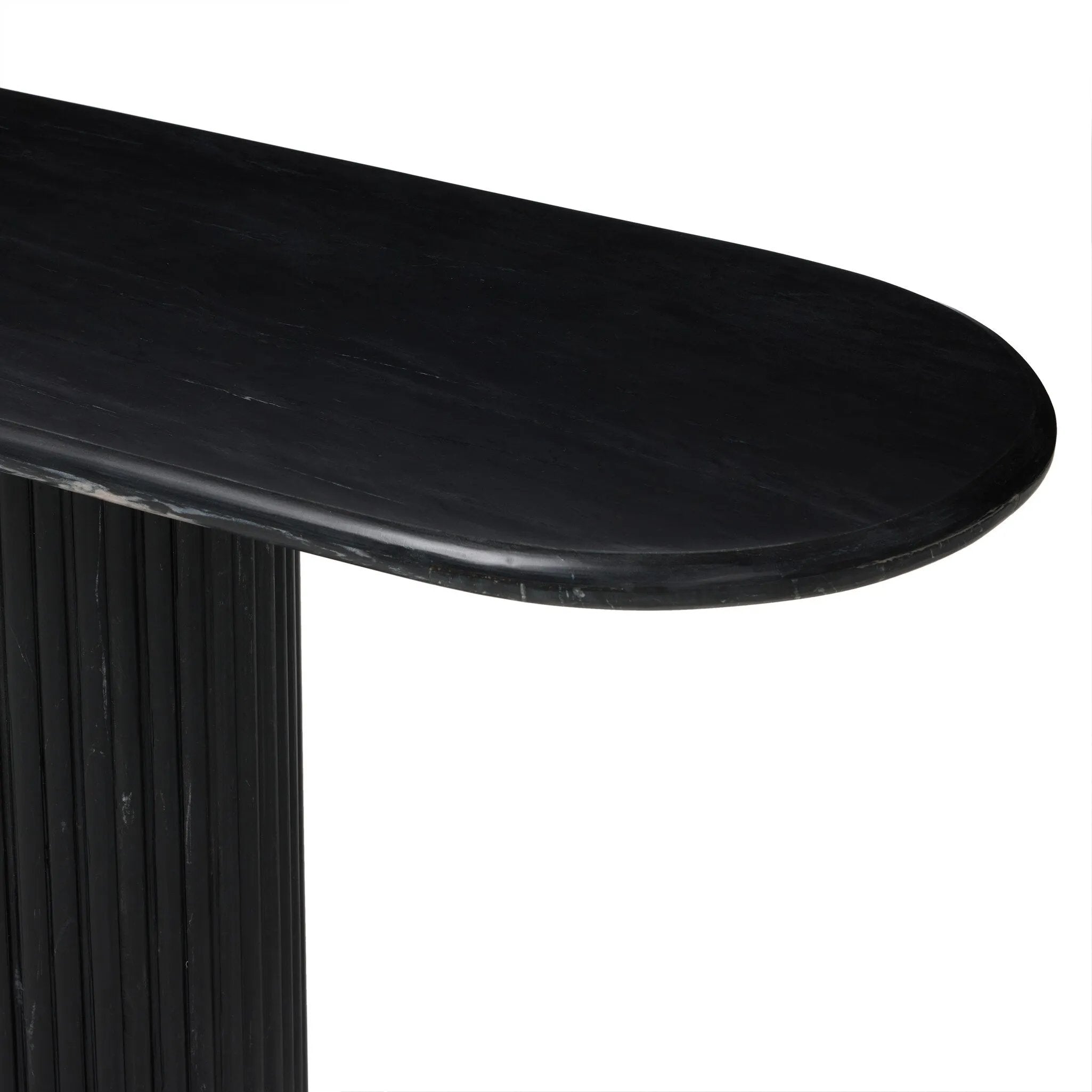 Italian-inspired for effortless sophistication. A black marble base is scalloped for a linear look with heavy texture, finished with a pill-shaped top for extra entryway styling atop this console table.As lovers of organic modern aesthetics at Amethyst, we love the designer inspired Oranda Console Table - Black Marble. Amethyst Home provides interior design, new home construction design consulting, vintage area rugs, and lighting in the Los Angeles metro area.