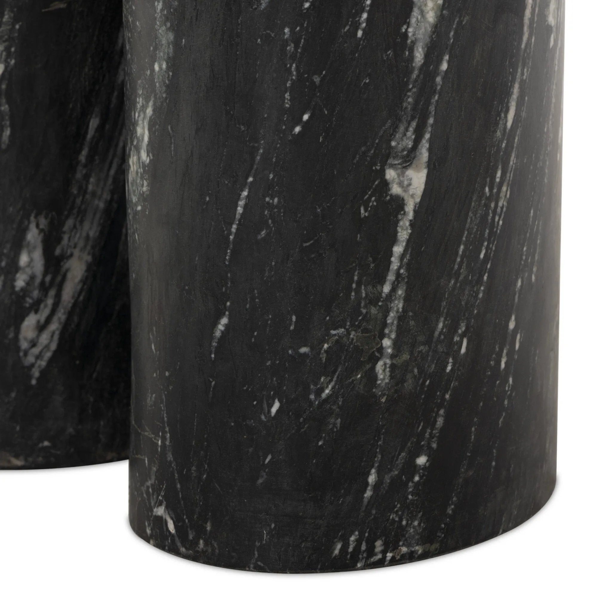 A material-driven piece inspired by post-modernism. A subtly organic round tabletop pairs with a swooped, sculptural pedestal base. Made from black marble for a striking, timeless look, with contrasting white veining playing up this piece's curves.As enthusiasts of luxe aesthetics at Amethyst, we love the designer inspired Oric Bistro Table. Amethyst Home provides interior design, new home construction design consulting, vintage area rugs, and lighting in the Monterey metro area.