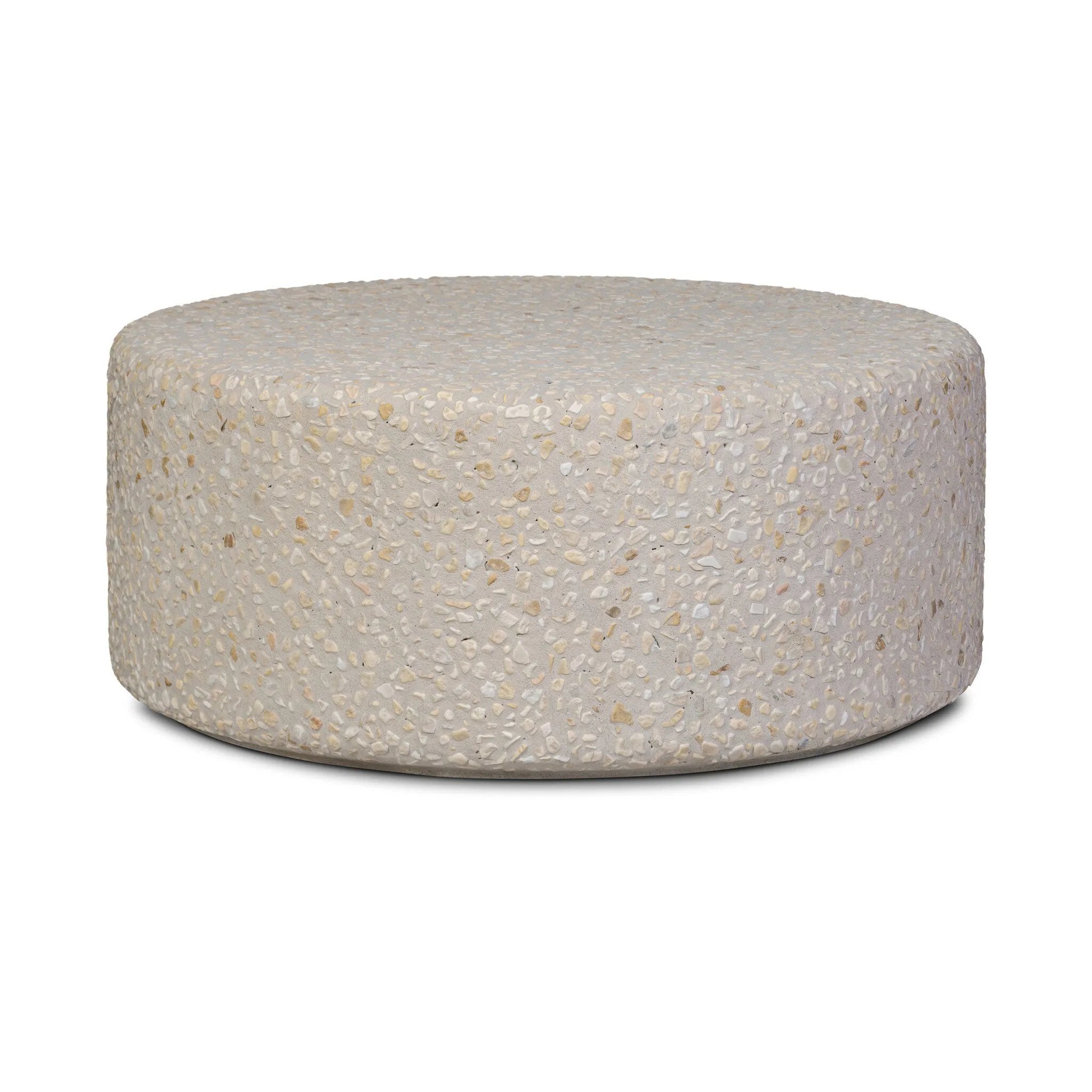 Natural stones form a neutral terrazzo pattern on a cream base, bringing a sense of texture and depth to this versatile coffee table. Designed with a clean, rounded silhouette, it works effortlessly in both indoor and outdoor spaces. Cover or store indoors during inclement weather and when not in use Amethyst Home provides interior design, new home construction design consulting, vintage area rugs, and lighting in the Laguna Beach metro area.