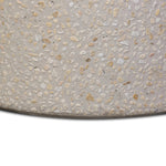 Natural stones form a neutral terrazzo pattern on a cream base, bringing a sense of texture and depth to this versatile coffee table. Designed with a clean, rounded silhouette, it works effortlessly in both indoor and outdoor spaces. Cover or store indoors during inclement weather and when not in use Amethyst Home provides interior design, new home construction design consulting, vintage area rugs, and lighting in the Nashville metro area.