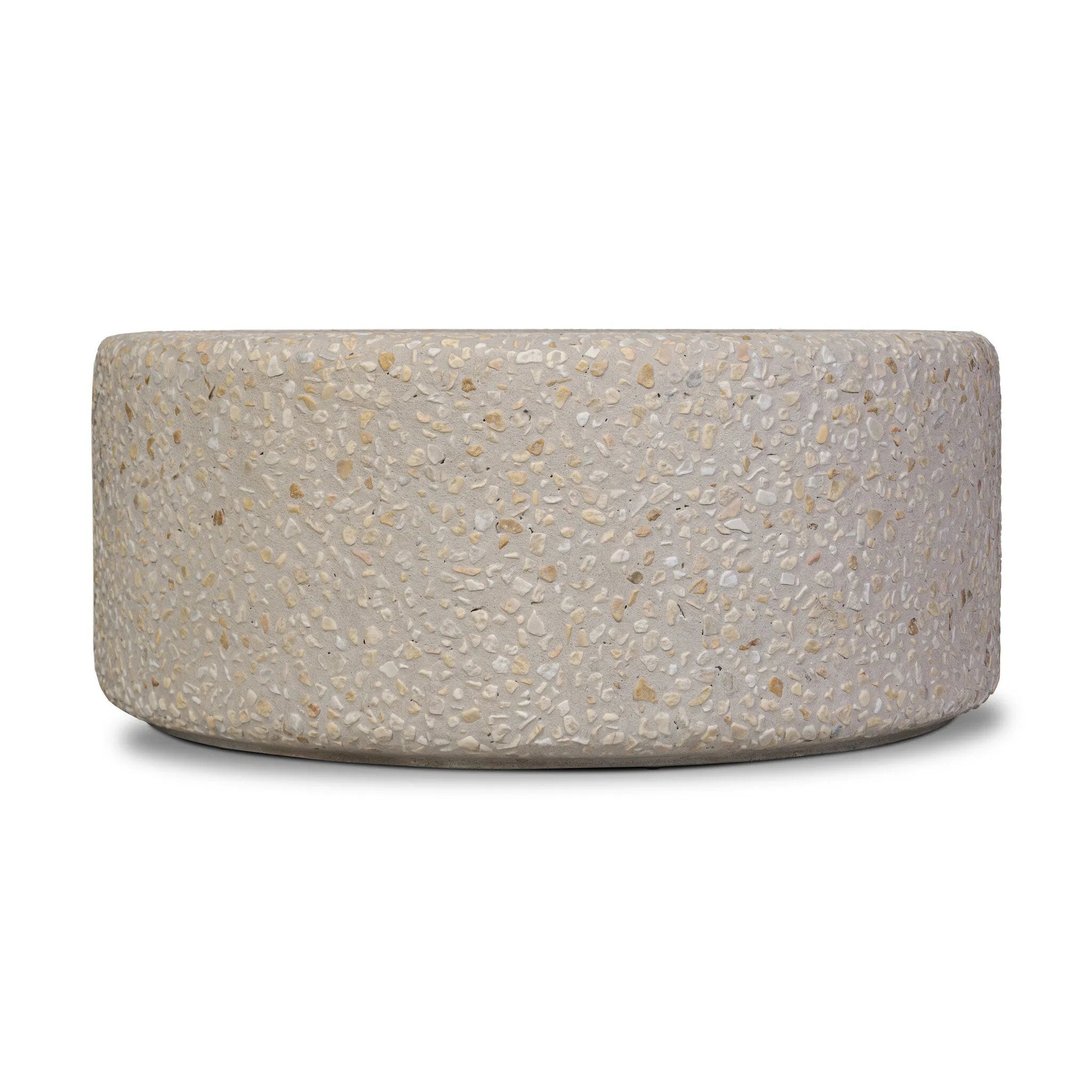 Natural stones form a neutral terrazzo pattern on a cream base, bringing a sense of texture and depth to this versatile coffee table. Designed with a clean, rounded silhouette, it works effortlessly in both indoor and outdoor spaces. Cover or store indoors during inclement weather and when not in use Amethyst Home provides interior design, new home construction design consulting, vintage area rugs, and lighting in the Salt Lake City metro area.