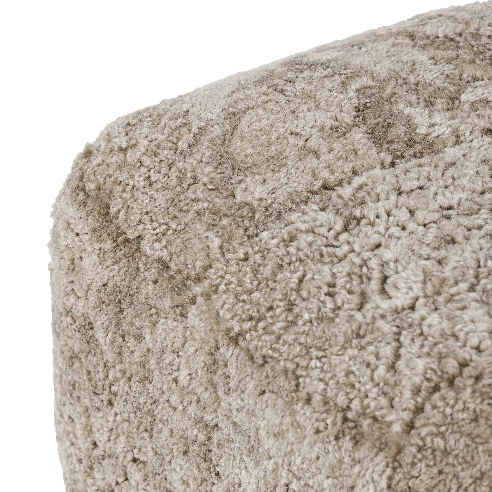 Featuring Oslo Taupe Shearling Ottoman by Four Hands at Amethyst Home. A subtle sweetheart shape paired with beige shearling plays into this ottoman's found object appeal. S-spring suspension offers a comfy place to sit and the shearling upholstery brings depth and vintage vibes throughout. Perfect styled alone or as part of a set for added drama. A design . Amethyst Home provides interior design, new home construction design consulting, vintage area rugs, and lighting in the San Diego metro area.