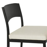 Streamlined and classic, this outdoor dining chair's simple silhouette features a subtly curved back on its matte black frame, finished with a cream linen-like seat cushion. Cover or store inside during inclement weather and when not in use. Amethyst Home provides interior design, new home construction design consulting, vintage area rugs, and lighting in the Austin metro area.