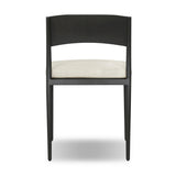 Streamlined and classic, this outdoor dining chair's simple silhouette features a subtly curved back on its matte black frame, finished with a cream linen-like seat cushion. Cover or store inside during inclement weather and when not in use. Amethyst Home provides interior design, new home construction design consulting, vintage area rugs, and lighting in the Des Moines metro area.