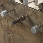 Inspired by Brutalist design, this outdoor foosball table is constructed of industrial oxidized aluminum panels, framing a travertine play surface atop a monolith plinth base that highlights the character of the finish. Two-toned players are cast in solid aluminum. Cover or store indoors during inclement weather and when not in use. Amethyst Home provides interior design, new home construction design consulting, vintage area rugs, and lighting in the Houston metro area.