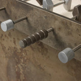 Inspired by Brutalist design, this outdoor foosball table is constructed of industrial oxidized aluminum panels, framing a travertine play surface atop a monolith plinth base that highlights the character of the finish. Two-toned players are cast in solid aluminum. Cover or store indoors during inclement weather and when not in use. Amethyst Home provides interior design, new home construction design consulting, vintage area rugs, and lighting in the Houston metro area.