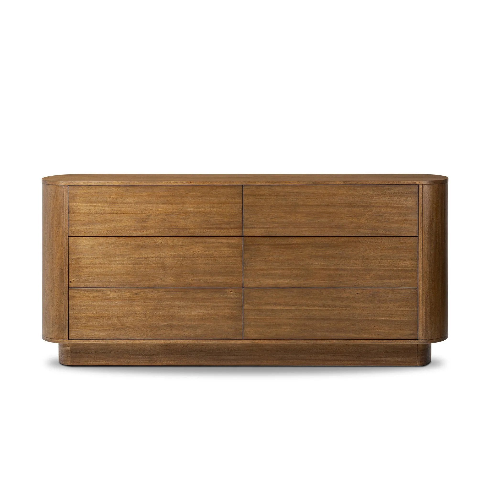 Seasoned brown acacia forms a pedestal base, bringing gentle curves to a classic dresser shape. Six drawers bring spacious storage to the bedroom Amethyst Home provides interior design, new home construction design consulting, vintage area rugs, and lighting in the Seattle metro area.
