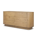 Light, worn oak forms a pedestal base, bringing gentle curves to a classic dresser shape. Six drawers bring spacious storage to the bedroom Amethyst Home provides interior design, new home construction design consulting, vintage area rugs, and lighting in the Tampa metro area.
