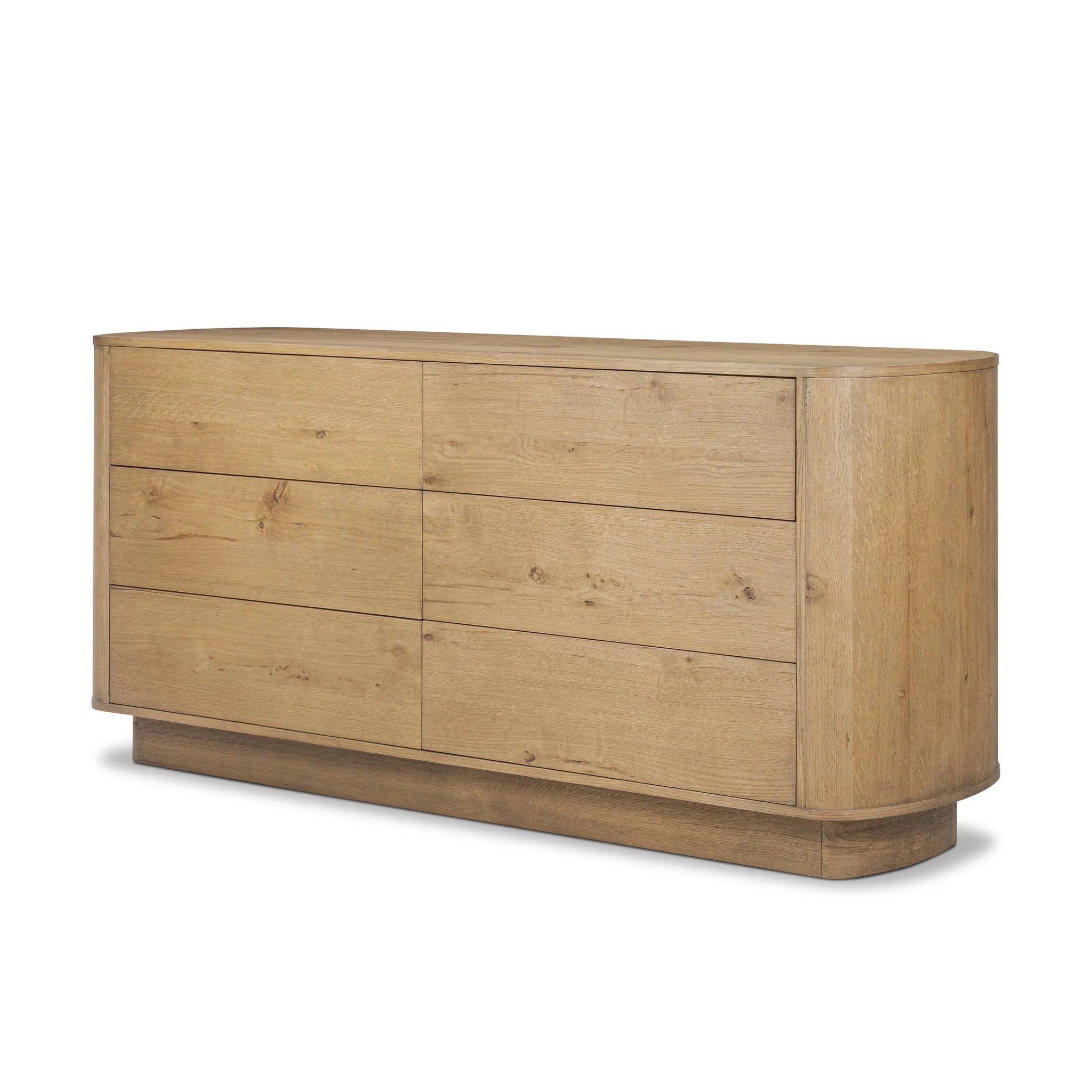 Light, worn oak forms a pedestal base, bringing gentle curves to a classic dresser shape. Six drawers bring spacious storage to the bedroom Amethyst Home provides interior design, new home construction design consulting, vintage area rugs, and lighting in the Tampa metro area.
