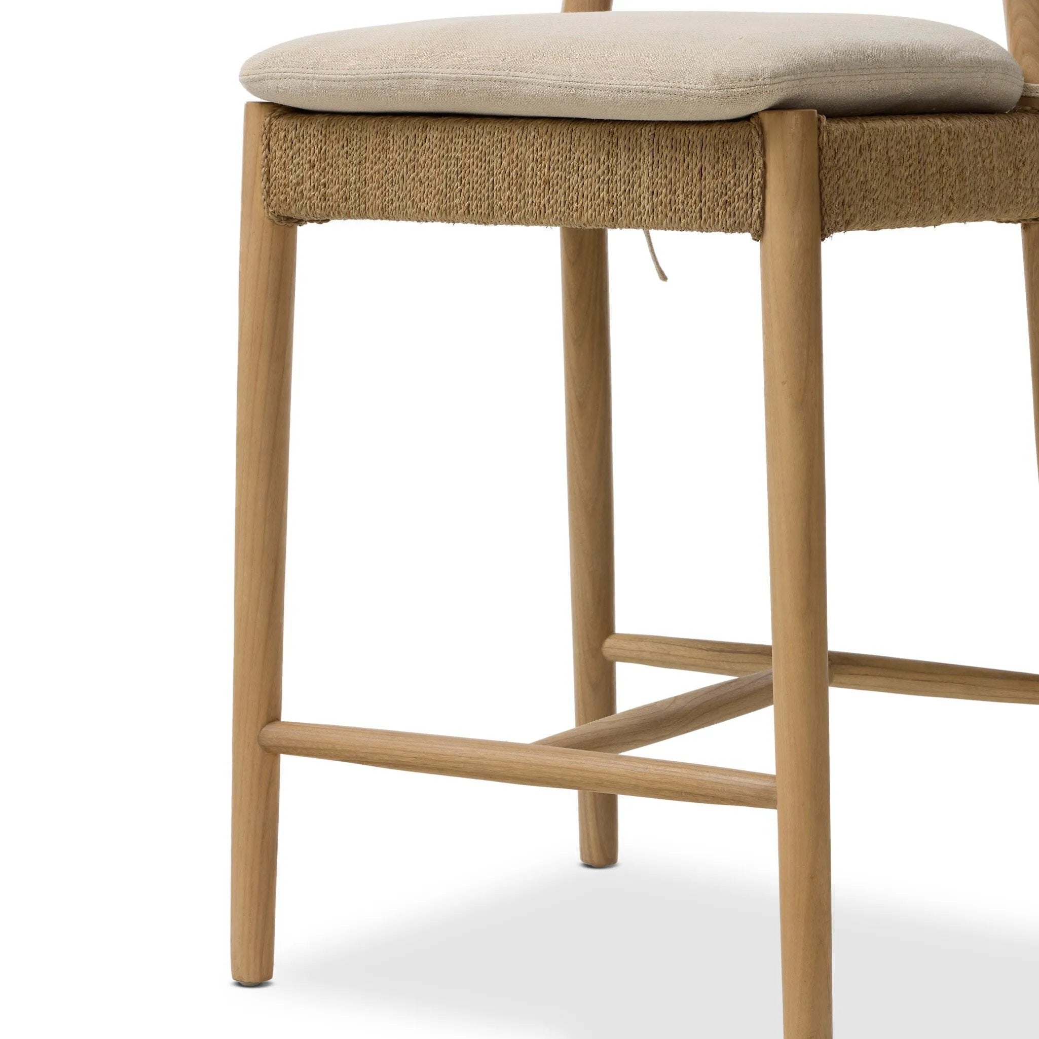 Mixed materials modernize this textural stool inspired by classic wishbone design. Natural sugar palm is cross-woven to create a seat and slim barrel back, all framed by smoked sungkai, with a cushion completing the look.As enthusiasts of wabi sabi materials at Amethyst, we love the nature inspired Pampa Counter Stool - Broadway Dune. Amethyst Home provides interior design, new home construction design consulting, vintage area rugs, and lighting in the Newport Beach metro area.