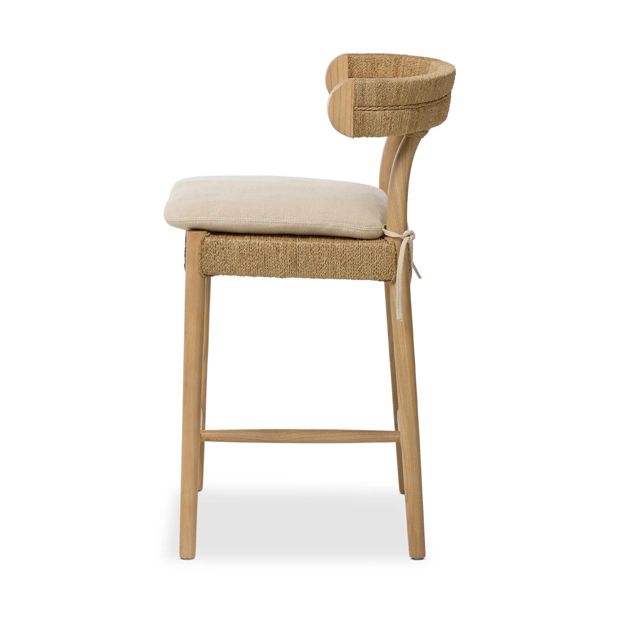 Mixed materials modernize this textural stool inspired by classic wishbone design. Natural sugar palm is cross-woven to create a seat and slim barrel back, all framed by smoked sungkai, with a cushion completing the look.As enthusiasts of wabi sabi materials at Amethyst, we love the nature inspired Pampa Counter Stool - Broadway Dune. Amethyst Home provides interior design, new home construction design consulting, vintage area rugs, and lighting in the San Diego metro area.
