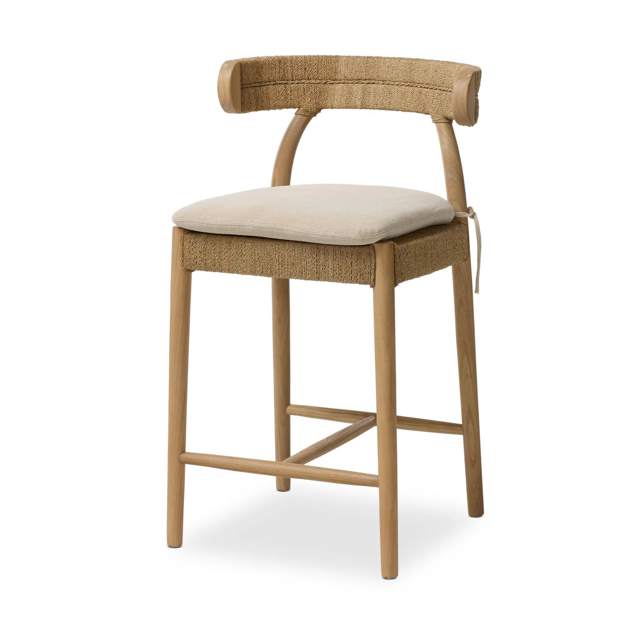Mixed materials modernize this textural stool inspired by classic wishbone design. Natural sugar palm is cross-woven to create a seat and slim barrel back, all framed by smoked sungkai, with a cushion completing the look.As enthusiasts of wabi sabi materials at Amethyst, we love the nature inspired Pampa Counter Stool - Broadway Dune. Amethyst Home provides interior design, new home construction design consulting, vintage area rugs, and lighting in the Washington metro area.