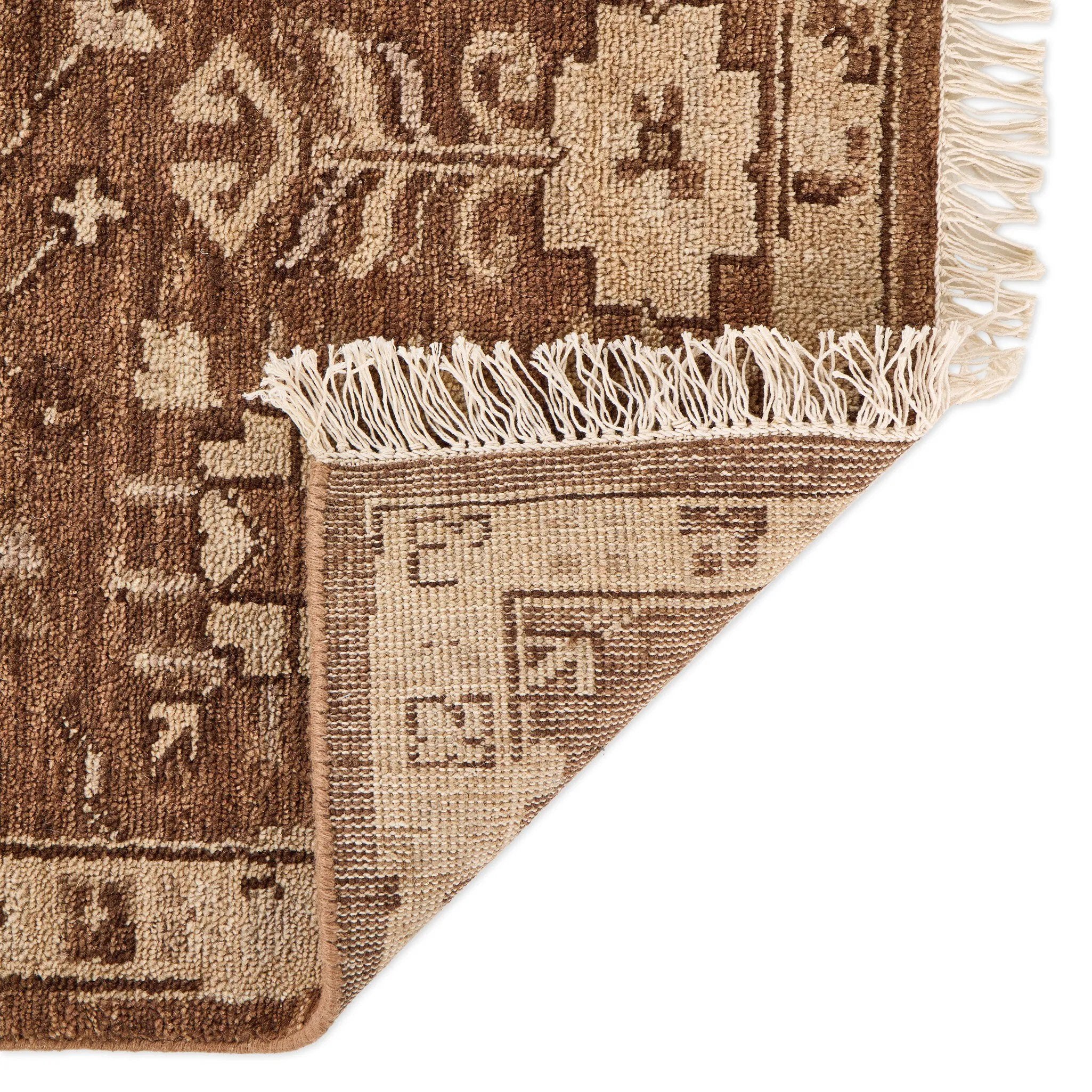 Pure wool is hand-knotted to create the rug's beautiful rustic design and appearance. The durable runner is crafted to wear beautifully over time. Due to the handcrafted nature of this rug, slight variations in sizing may occur Amethyst Home provides interior design, new home construction design consulting, vintage area rugs, and lighting in the Houston metro area.