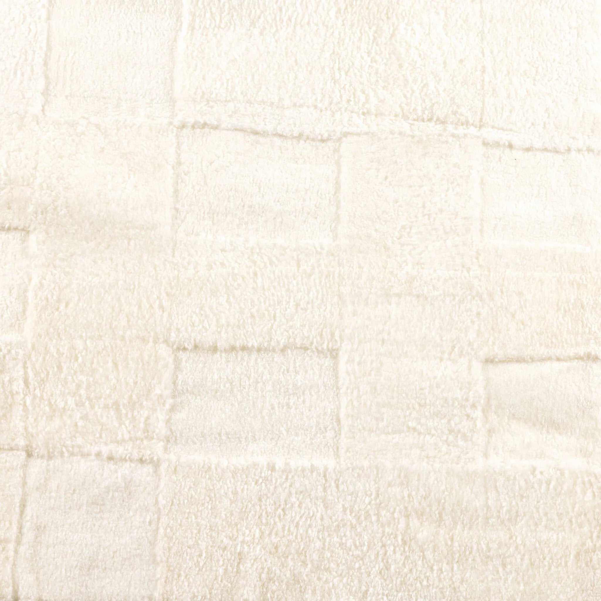 Patchwork Cream Shorn Shearling Rug is shaved to different heights and stitched together to create a tonal checked pattern for a modern yet classic look. Subtle color variations bring a natural, more organic feel to the rug. The material, pattern, and hues come together to craft an unexpected bold style Amethyst Home provides interior design, new home construction design consulting, vintage area rugs, and lighting in the Miami metro area.