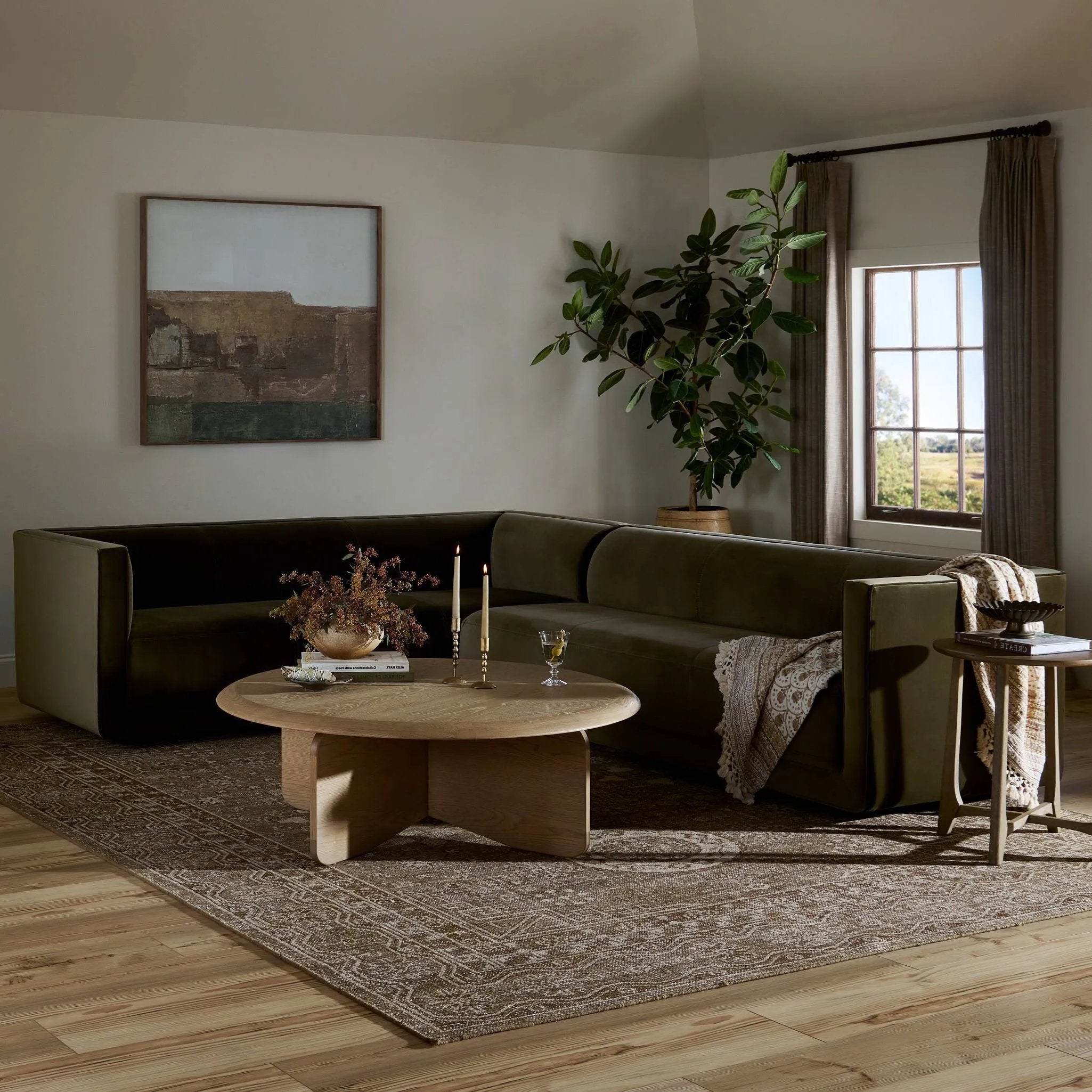 A clean, angular sectional in an eye-catching color. Upholstered in an olive cotton blend, with blind stitching along the seat and back cushions. The slight pronounced seat cushion creates an illusion of being loose, but is actually a fixed cushion with expert tailoring. A piping channel detail gives the arm a finished look Amethyst Home provides interior design, new home construction design consulting, vintage area rugs, and lighting in the Tampa metro area.