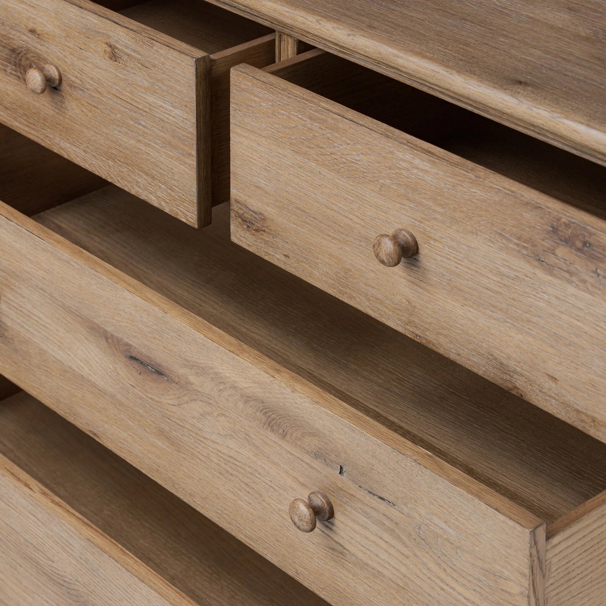 A classic chest stores in everlasting style. Crafted with heavy weathered oak with natural cracks and graining, the front has beading around the drawers for an heirloom appeal. It's finished in a tonal brown, with turned wood hardware Amethyst Home provides interior design, new home construction design consulting, vintage area rugs, and lighting in the Portland metro area.