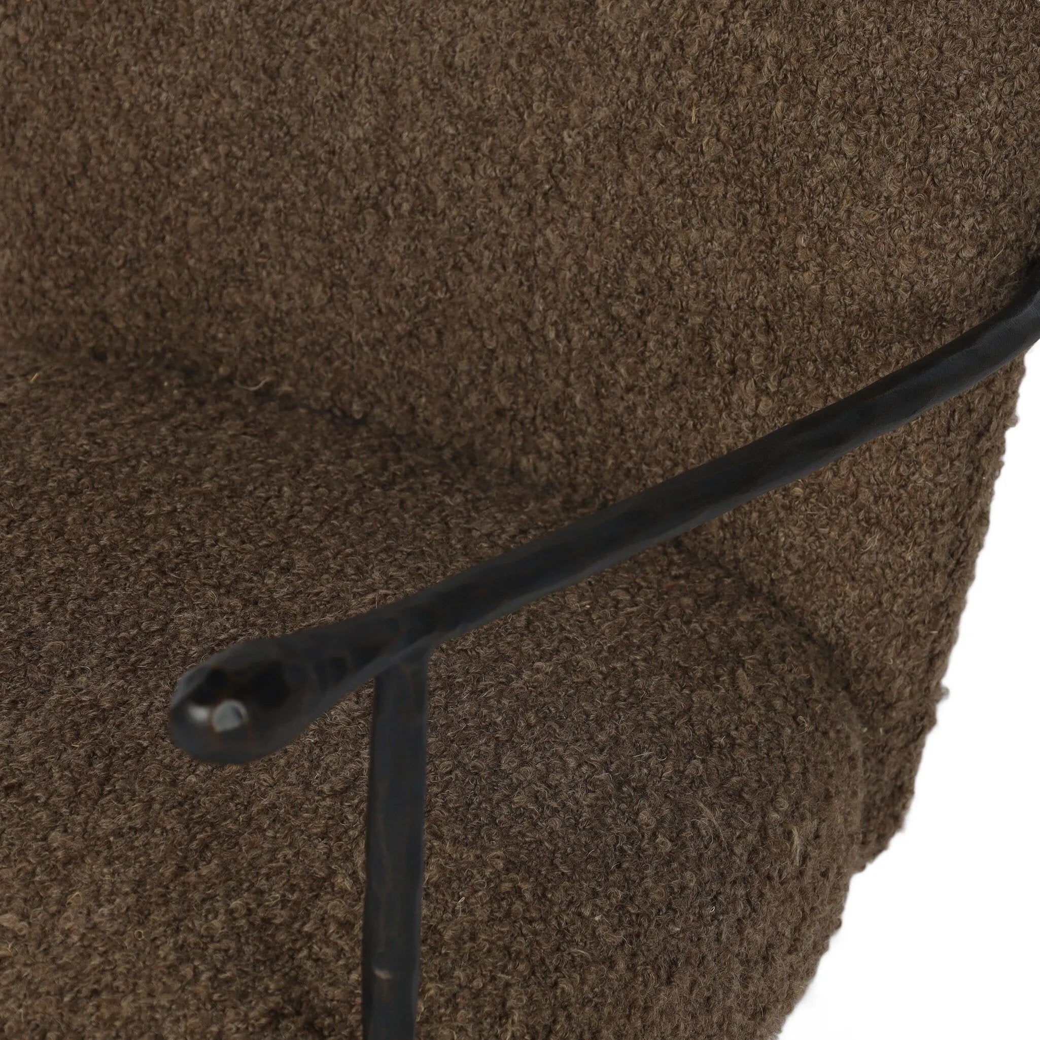 Work in comfort and style with this texture-driven desk chair. Black hammered and forged iron arms frame a seat and back upholstered in a textured weave  fabric. Performance fabrics are specially created to withstand spills, stains, high traffic and wear, ensuring long-term comfort and unmatched durability. Amethyst Home provides interior design, new home construction design consulting, vintage area rugs, and lighting in the Newport Beach metro area.