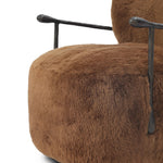 Make a statement with this texture-driven swivel chair. Made from 100% sheared sheepskin. For a unique design detail, black iron arms wrap around the back of the chair and have been hammered for even more texture. A 360-swivel base is inset for a clean look. Amethyst Home provides interior design, new home construction design consulting, vintage area rugs, and lighting in the Dallas metro area.