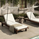Drawing inspiration from antique rickshaws, this outdoor chaise features wheels and a built-in handle at the front for easy mobility. The adjustable and removable shade canopy offers customizable sun protection, with style. Cover or store inside during inclement weather and when not in use. Amethyst Home provides interior design, new home construction design consulting, vintage area rugs, and lighting in the Boston metro area.