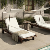 Drawing inspiration from antique rickshaws, this outdoor chaise features wheels and a built-in handle at the front for easy mobility. The adjustable and removable shade canopy offers customizable sun protection, with style. Cover or store inside during inclement weather and when not in use. Amethyst Home provides interior design, new home construction design consulting, vintage area rugs, and lighting in the Boston metro area.