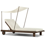 Drawing inspiration from antique rickshaws, this outdoor chaise features wheels and a built-in handle at the front for easy mobility. The adjustable and removable shade canopy offers customizable sun protection, with style. Cover or store inside during inclement weather and when not in use. Amethyst Home provides interior design, new home construction design consulting, vintage area rugs, and lighting in the Salt Lake City metro area.