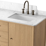 A simple transitional shape designed to function across styles. This bath vanity nods to heritage designs with the softly shaped backsplash, dowel legs, rounded corners and arch frame detail, finished with mixed hardware for added visual interest. Finished with a bath-safe sealant for moisture resistance. Amethyst Home provides interior design, new home construction design consulting, vintage area rugs, and lighting in the Charlotte metro area.