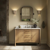 A simple transitional shape designed to function across styles. This bath vanity nods to heritage designs with the softly shaped backsplash, dowel legs, rounded corners and arch frame detail, finished with mixed hardware for added visual interest. Finished with a bath-safe sealant for moisture resistance. Amethyst Home provides interior design, new home construction design consulting, vintage area rugs, and lighting in the Austin metro area.