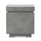 This outdoor propane tank enclosure pairs with fire tables for a clean, seamless look. Made from glass-reinforced concrete, each piece is naturally finished with deep tones of pewter and dark grey. It can act as an end table with its lid on, and has cutouts at the base for hose attachments. Amethyst Home provides interior design, new home construction design consulting, vintage area rugs, and lighting in the Kansas City metro area.