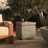 This outdoor propane tank enclosure pairs with fire tables for a clean, seamless look. Made from glass-reinforced concrete, each piece is naturally finished with deep tones of pewter and dark grey. It can act as an end table with its lid on, and has cutouts at the base for hose attachments. Amethyst Home provides interior design, new home construction design consulting, vintage area rugs, and lighting in the Seattle metro area.