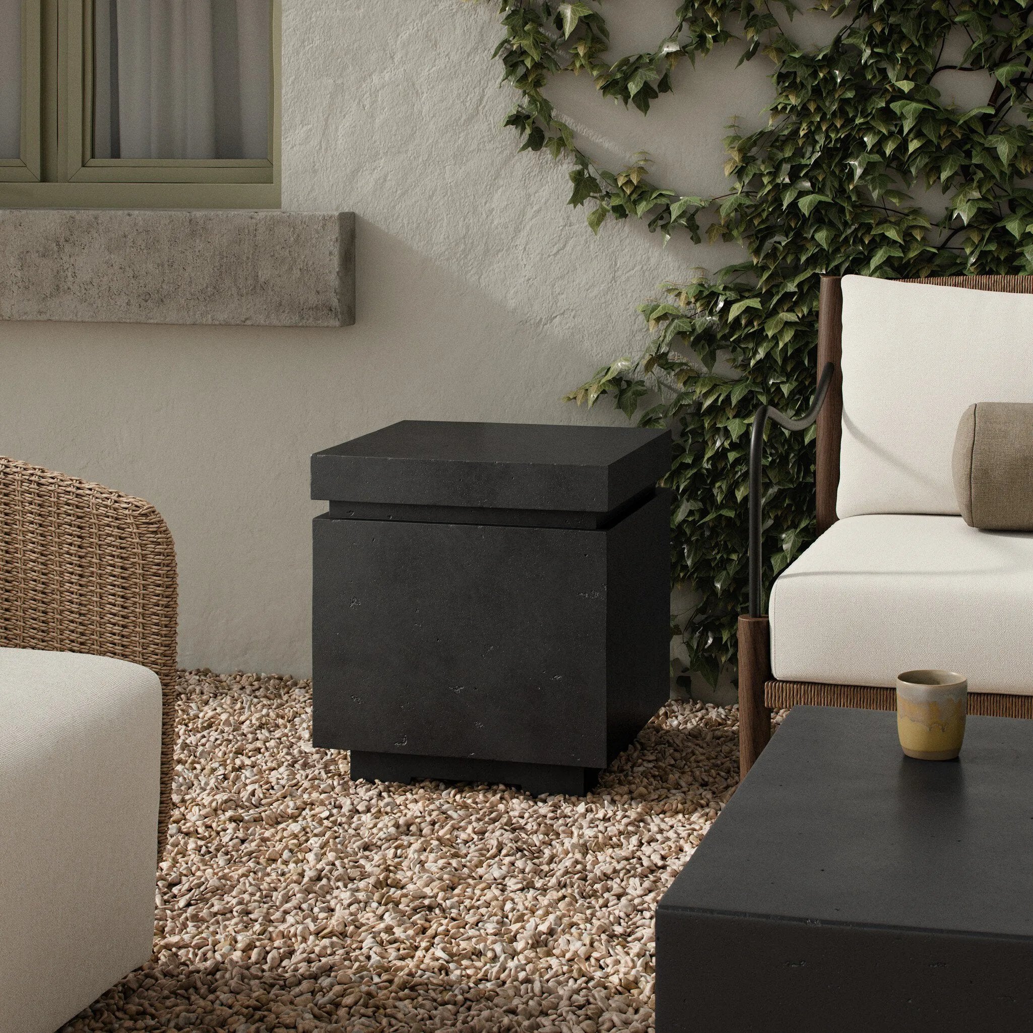 This outdoor propane tank enclosure pairs with fire tables for a clean, seamless look. Made from glass-reinforced concrete, each piece is naturally finished with deep tones of charcoal. It can act as an end table with its lid on, and has cutouts at the base for hose attachments. Cover or store indoors during inclement weather and when not in use. Amethyst Home provides interior design, new home construction design consulting, vintage area rugs, and lighting in the Monterey metro area.
