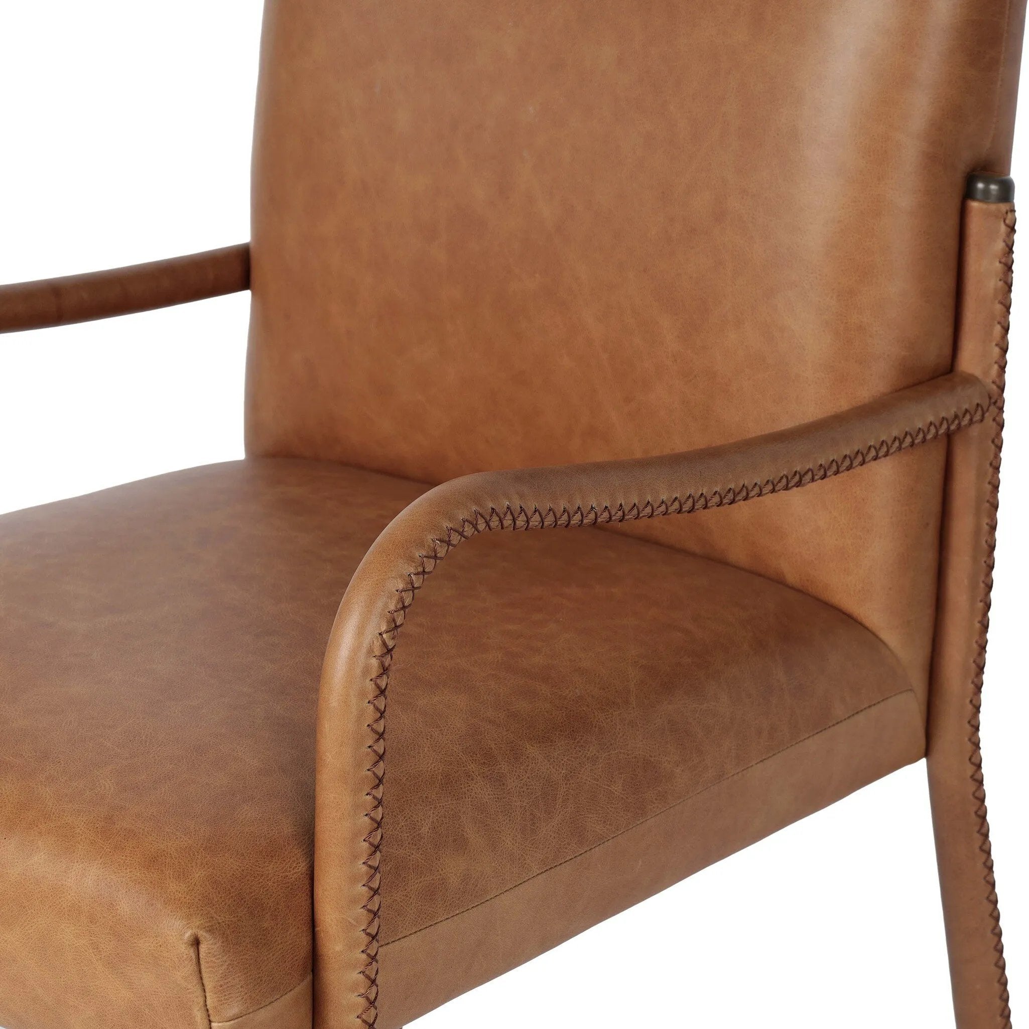 A slim seating style with timeless materials. An armless chair is fully upholstered in butterscotch top-grain leather with a subtle vintage look. Iron legs are also covered in leather, with exposed stitching along each leg. Finished with wooden armrests prime for the head of the table. Amethyst Home provides interior design, new home construction design consulting, vintage area rugs, and lighting in the Seattle metro area.