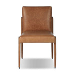 A slim seating style with timeless materials. An armless chair is fully upholstered in butterscotch top-grain leather with a subtle vintage look. Iron legs are also covered in leather, with exposed stitching along each leg.As enthusiasts of luxe design at Amethyst, we love the warm modern inspired Quill Dining Chair. Amethyst Home provides interior design, new home construction design consulting, vintage area rugs, and lighting in the Boston metro area.