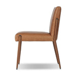 A slim seating style with timeless materials. An armless chair is fully upholstered in butterscotch top-grain leather with a subtle vintage look. Iron legs are also covered in leather, with exposed stitching along each leg.As enthusiasts of luxe design at Amethyst, we love the warm modern inspired Quill Dining Chair. Amethyst Home provides interior design, new home construction design consulting, vintage area rugs, and lighting in the Laguna Beach metro area.