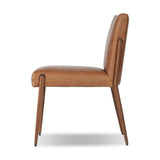 A slim seating style with timeless materials. An armless chair is fully upholstered in butterscotch top-grain leather with a subtle vintage look. Iron legs are also covered in leather, with exposed stitching along each leg.As enthusiasts of luxe design at Amethyst, we love the warm modern inspired Quill Dining Chair. Amethyst Home provides interior design, new home construction design consulting, vintage area rugs, and lighting in the Laguna Beach metro area.