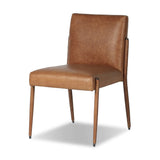A slim seating style with timeless materials. An armless chair is fully upholstered in butterscotch top-grain leather with a subtle vintage look. Iron legs are also covered in leather, with exposed stitching along each leg.As enthusiasts of luxe design at Amethyst, we love the warm modern inspired Quill Dining Chair. Amethyst Home provides interior design, new home construction design consulting, vintage area rugs, and lighting in the Omaha metro area.