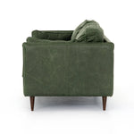 Featuring Reese Eden Sage Sofa by Four Hands at Amethyst Home. Effortlessly on-trend. Two-cushion seating of sage top-grain leather, with knife-edge pillows and welted track arms. Almond-finished legs taper for a modern touch atop mid-century influence.Overall Dimensions: 76.00"w x 35.00"d x 32.75"hWeight : 110.89 lbsMaterials: Top Grain Leather, Poplar Plywo. Amethyst Home provides interior design, new home construction design consulting, vintage area rugs, and lighting in the Houston metro area.