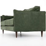 Featuring Reese Eden Sage Sofa by Four Hands at Amethyst Home. Effortlessly on-trend. Two-cushion seating of sage top-grain leather, with knife-edge pillows and welted track arms. Almond-finished legs taper for a modern touch atop mid-century influence.Overall Dimensions: 76.00"w x 35.00"d x 32.75"hWeight : 110.89 lbsMaterials: Top Grain Leather, Poplar Plywood. Amethyst Home provides interior design, new home construction design consulting, vintage area rugs, and lighting in the Omaha metro area.